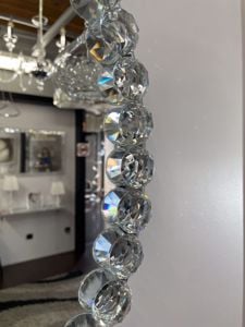 Specchio ovale da parete decorativo per camera da letto bordo di cristalli 100x70